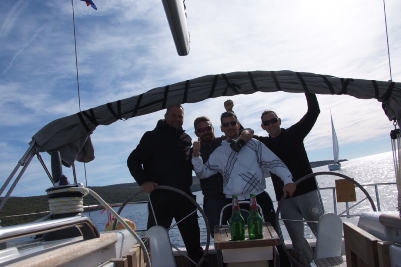 The winning crew on boat Bura with skipper Miro Volaric, a moment after passing the finish line 